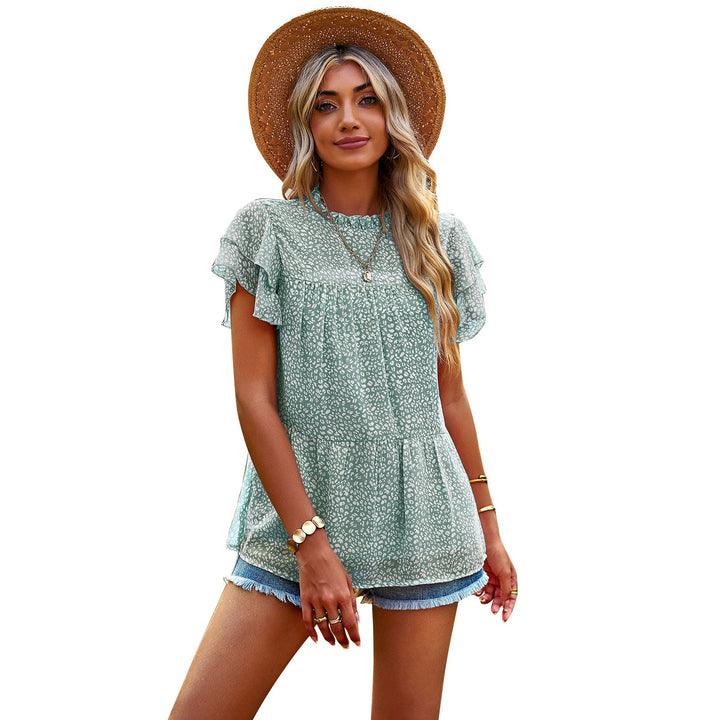 Stilfull mönstrad blus för dam med unika designer, eleganta volangärmar. Passar både vardag och fest.