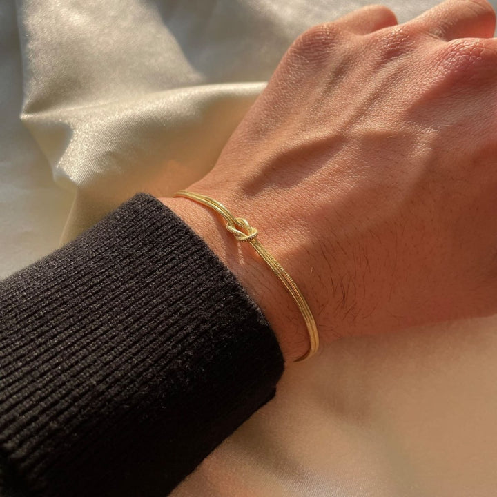 Minimalistiskt smycke för dam, justerbart armband med knopdetalj
