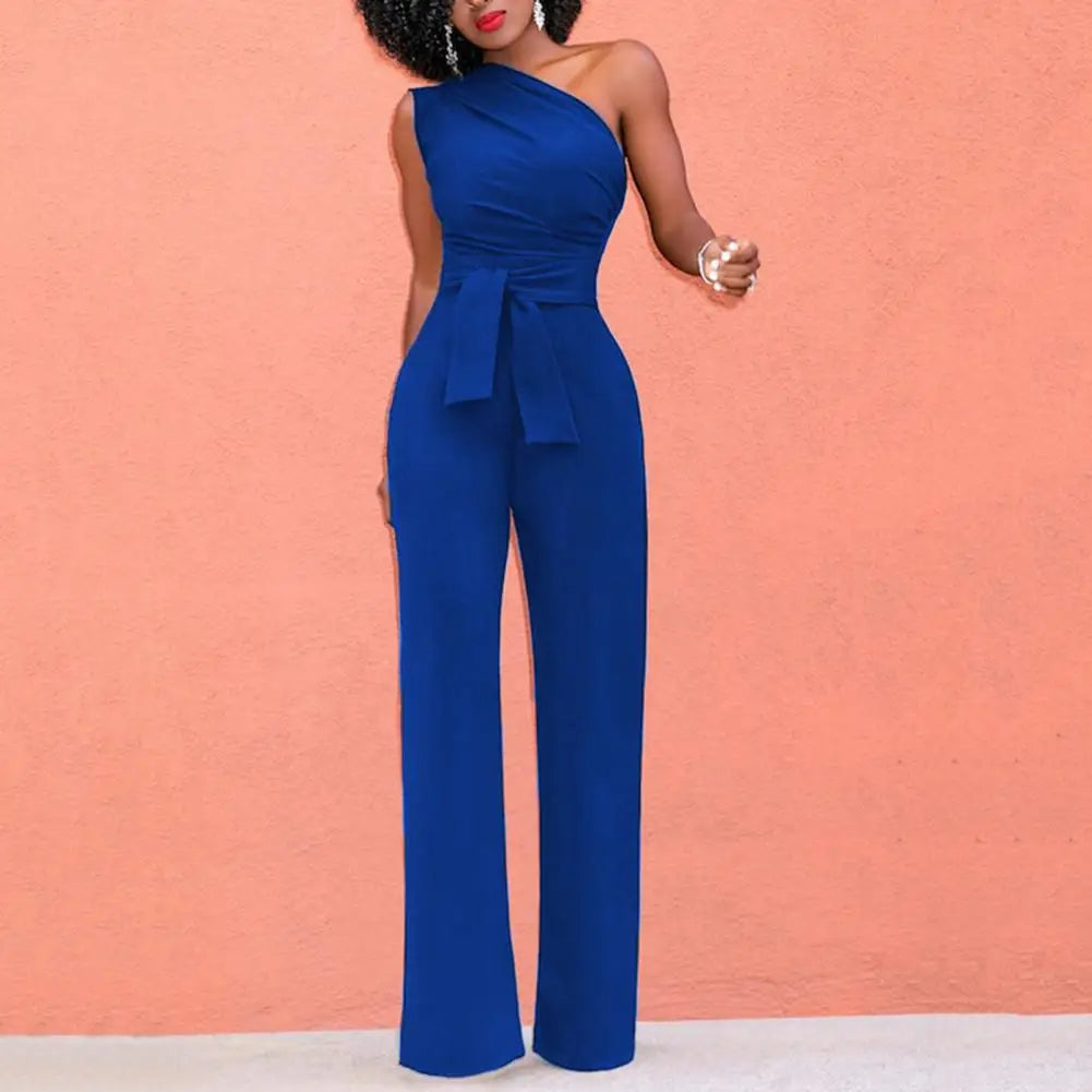 Chic enaxlad jumpsuit för dam. Enfärgad, lös passform med knytskärp. Elegant och bekväm för fest eller vardag.