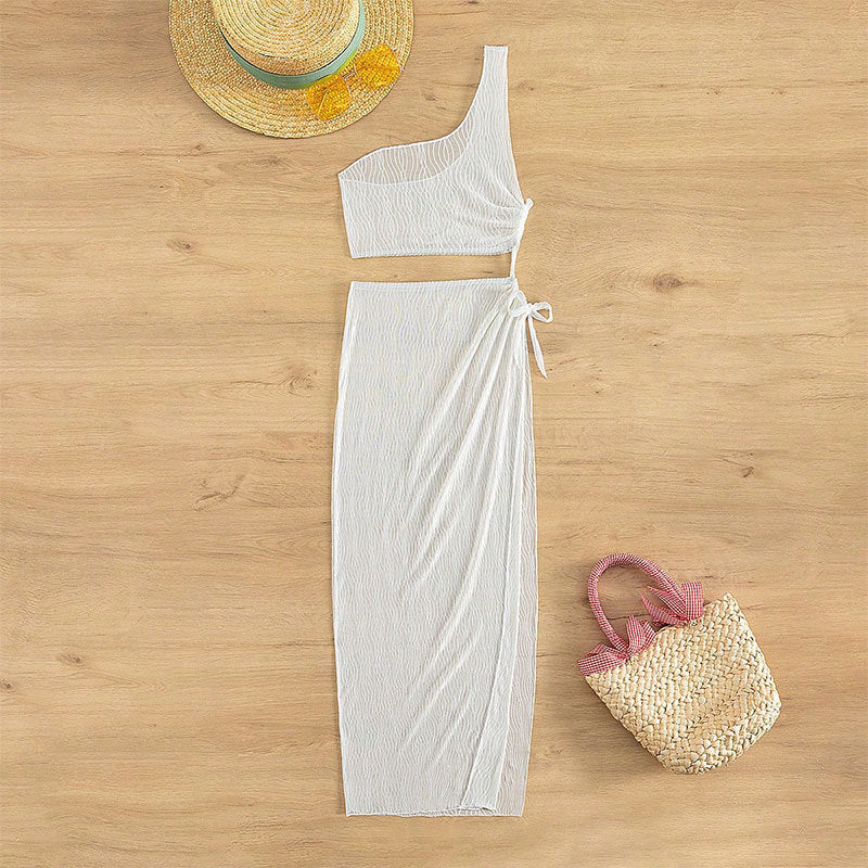 Modern damknytdress med asymmetrisk design och elastisk midja, en bekväm sommaroutfit.