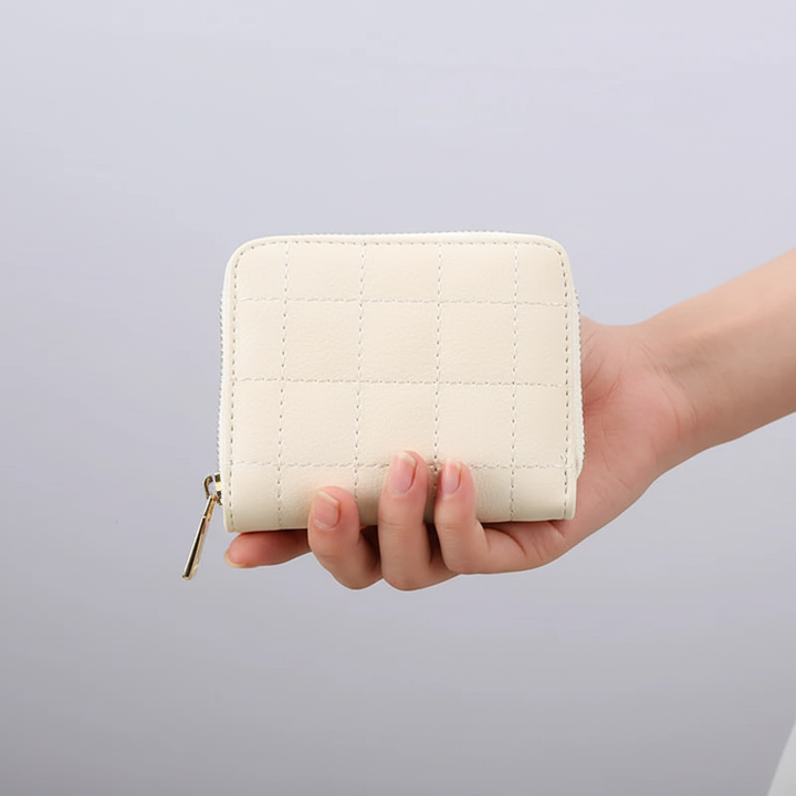 GleamWallet kompakt damplånbok i läder. Elegant korthållare med fack för mynt och kort.