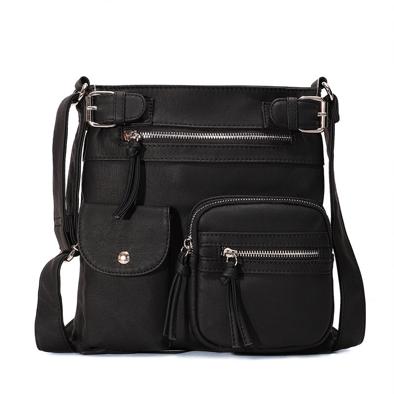 "Elegant damväska i veganskt läder, crossbody med flera fickor, vattentät och stilfull design för optimal organisation."