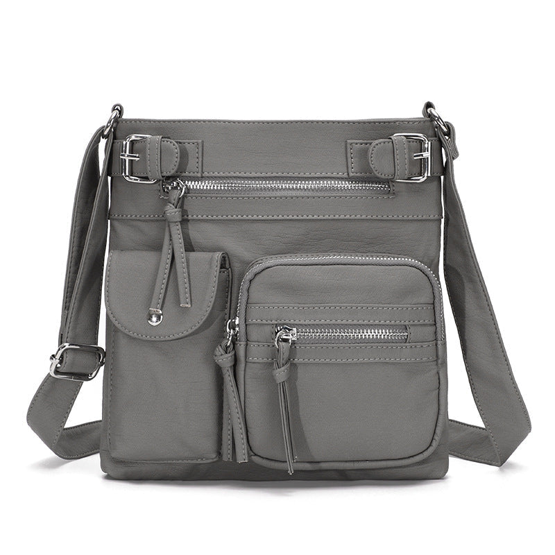 "Elegant damväska i veganskt läder, crossbody med flera fickor, vattentät och stilfull design för optimal organisation."