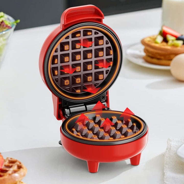 Kompakt elektriskt mini-våffeljärn med non-stick-beläggning, perfekt för små kök och resor.