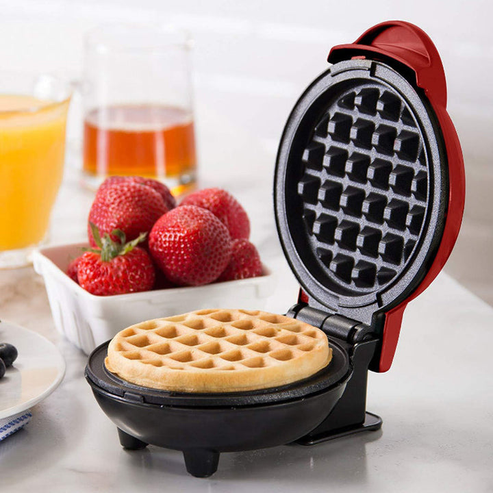 Kompakt elektriskt mini-våffeljärn med non-stick-beläggning, perfekt för små kök och resor.
