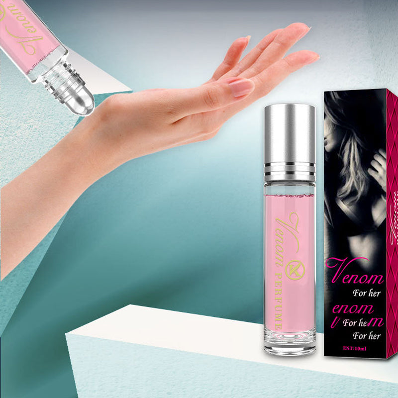 "Elegant flaska med rosa/guld toner, 10ml feromonparfym för män och kvinnor, förstärker naturlig attraktion."