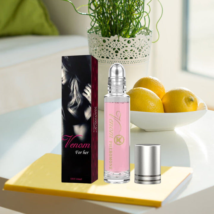 "Elegant flaska med rosa/guld toner, 10ml feromonparfym för män och kvinnor, förstärker naturlig attraktion."