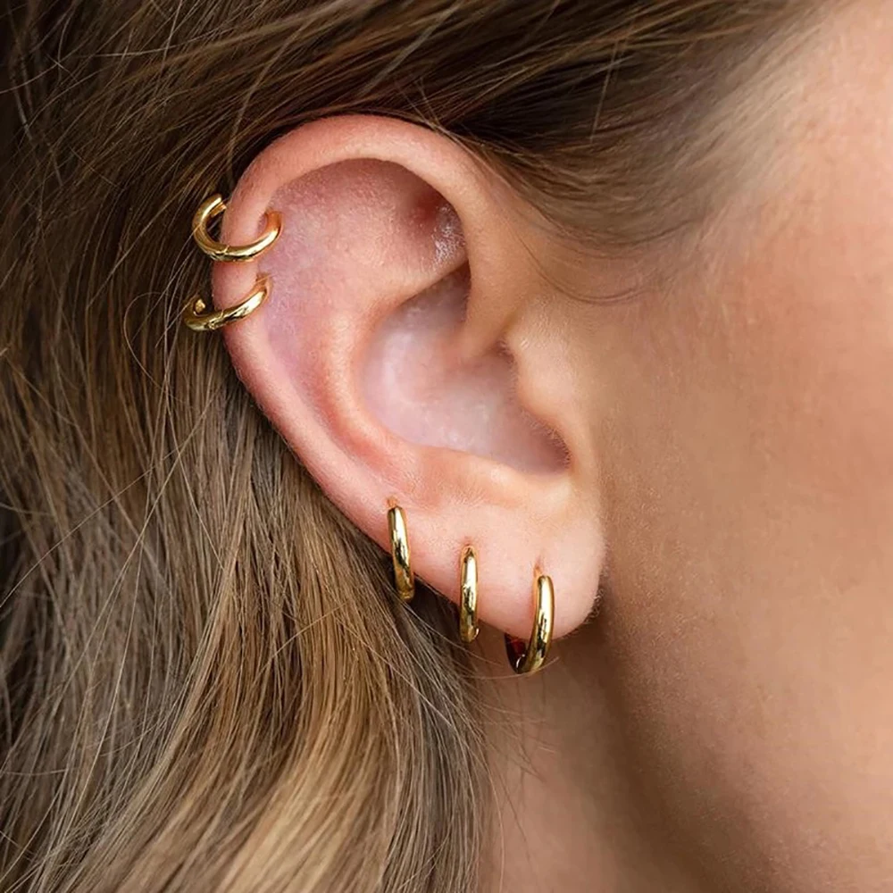 Elegant guldpläterat creolörhänge för dam. Tidlöst hoopörhänge i klassisk design, perfekt för varje tillfälle.