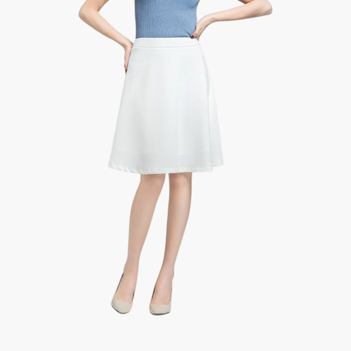 Elegant högmidjad damkjol. Mångsidig knälång kjol som fungerar lika bra som festkjol & vardagskjol.