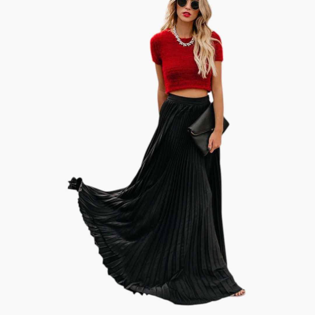 Plisserad A-linje maxikjol för kvinnor, högmidjad design. En elegant och modern långkjol för sommarens mode.