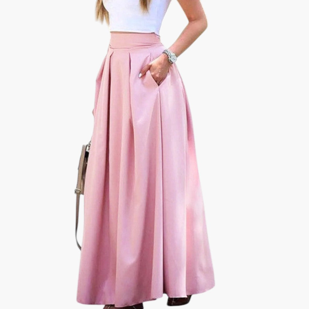Bekväm och elegant högmidjad plisserad maxikjol med fickor, perfekt för vår- och sommaroutfits.