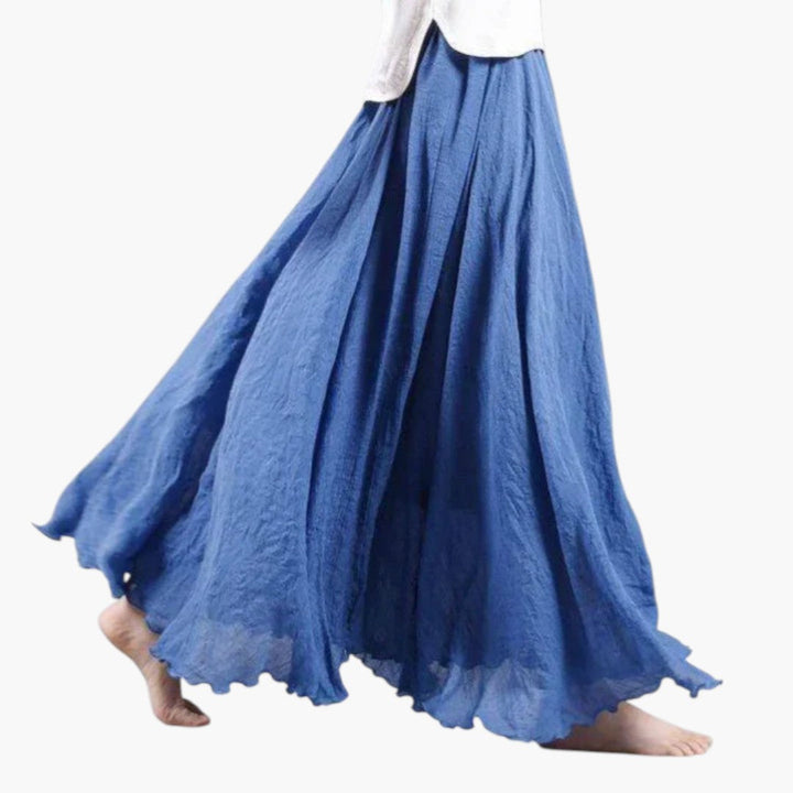 Flödande lång maxikjol med rynkad hög midja. En bekväm och elegant A-linje kjol för sommar och fest.