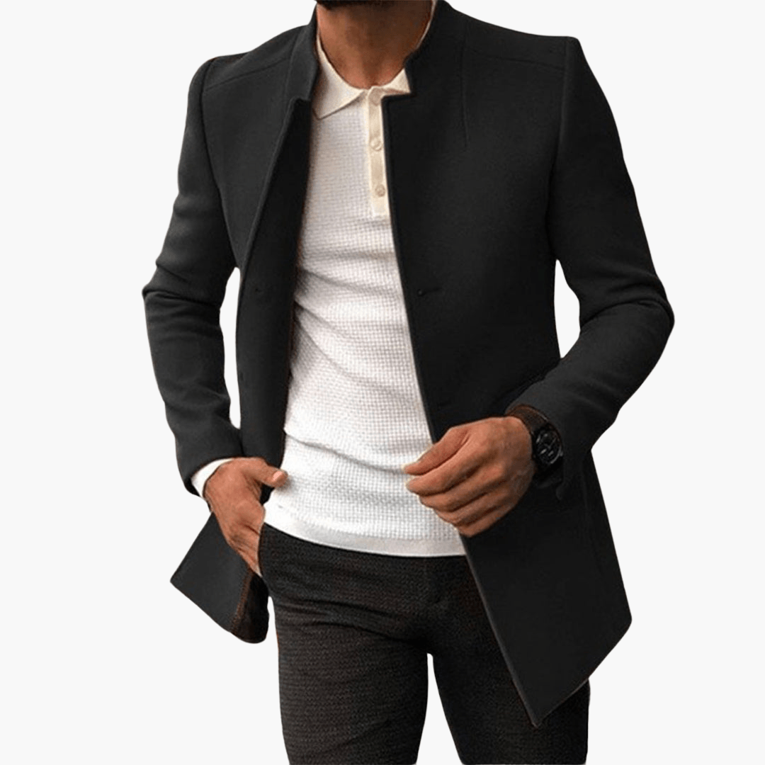 Grå herrrock med ståkrage, ett tidlöst ytterplagg för elegant vardagsstil. Perfekt som vinterjacka.