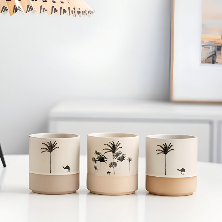 Elegant keramik kaffekoppset med stilrent palmönster, perfekt för espresso och te.