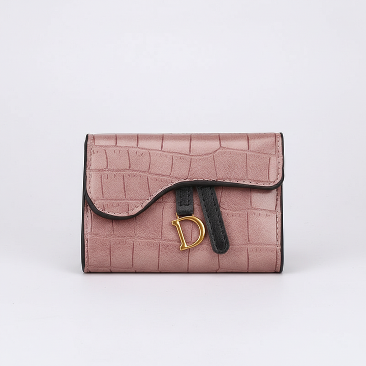 Närbild på det detaljerade krokodilmönstret på en elegant damplånbok i PU-läder. En tidlös modeaccessoar.