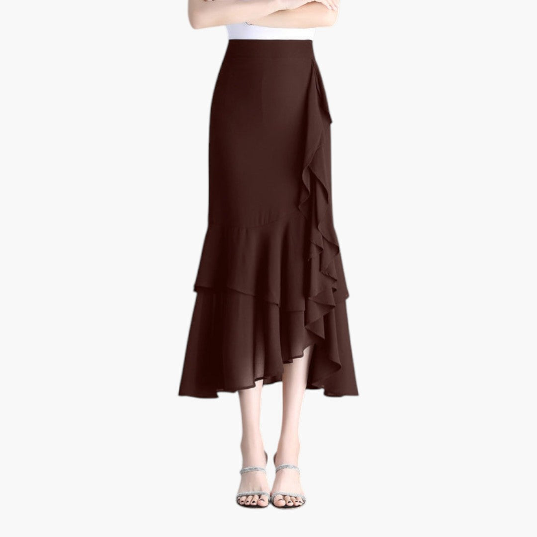 Flytande mönstrad midi-kjol med elegant hög midja och asymmetriska volanger. Modern damkjol.