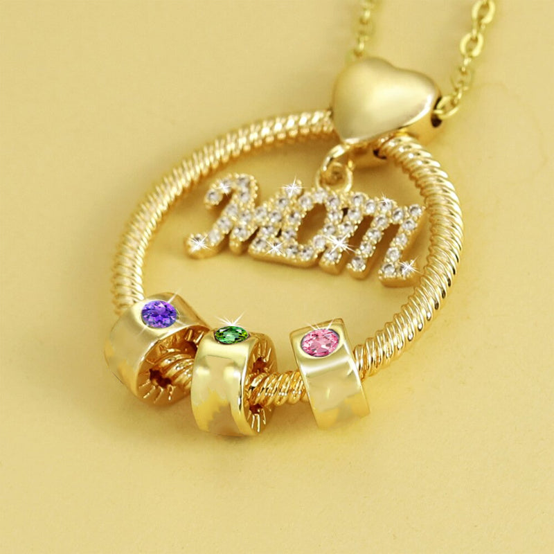 Elegant mammas halsband med födelsesten i guld, intrikat hjärtdesign och tvinnad repdetalj för kvinnor.