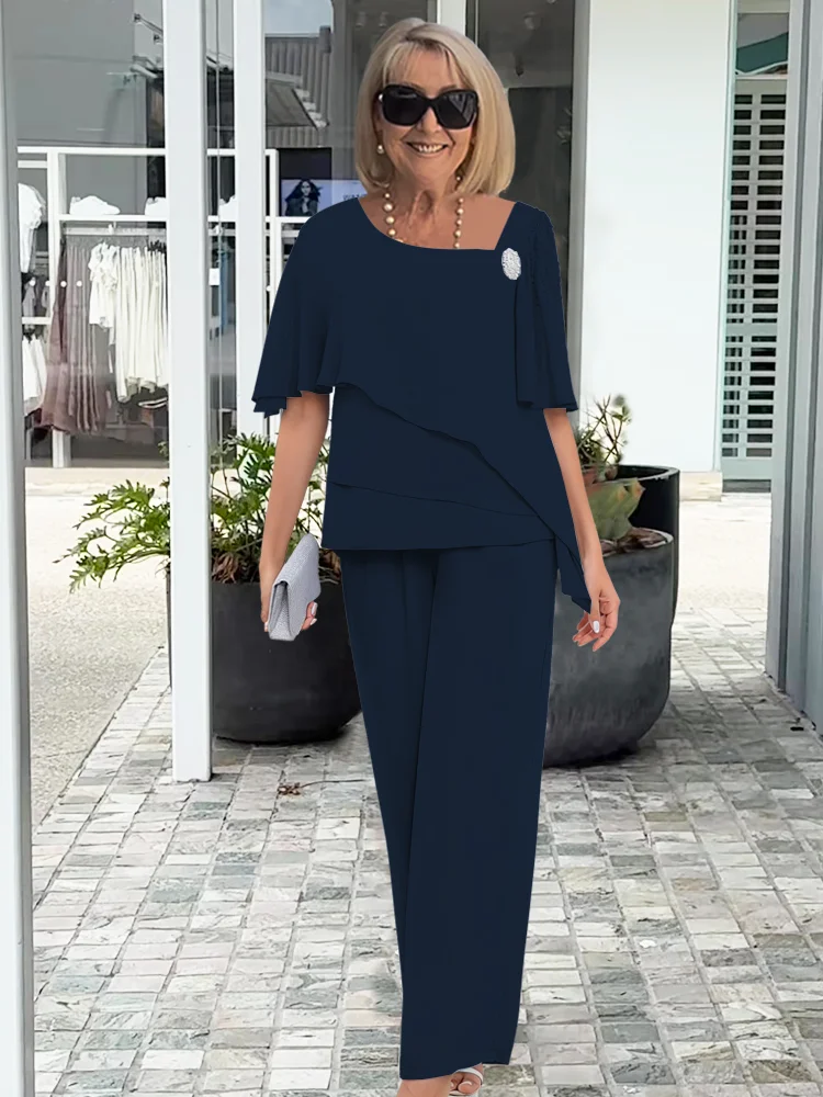 Chic dam festoutfit i marinblått, tvådelat set med topp och byxor. Mångsidig för sommarfest & vardagsfest.