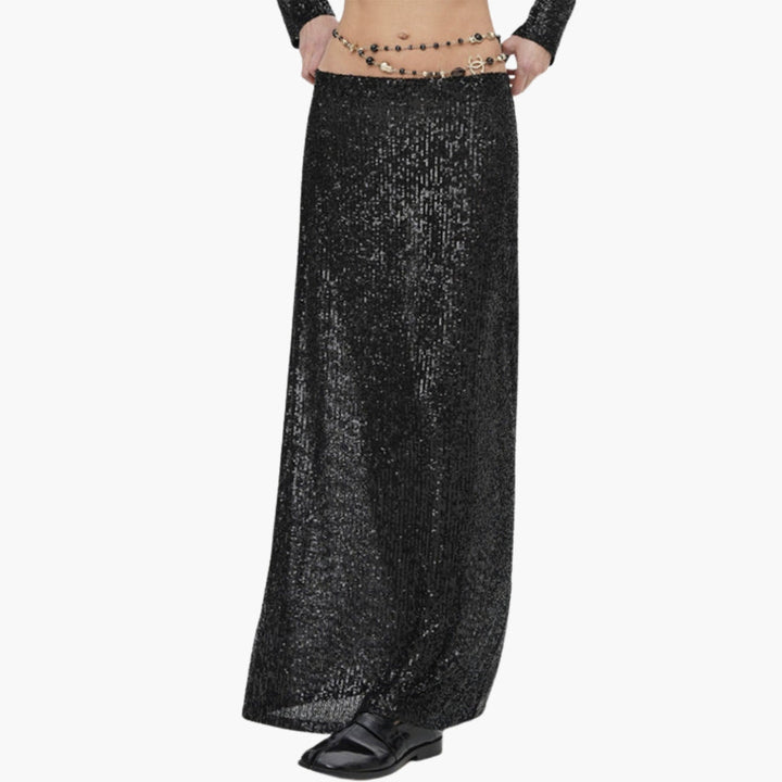 Trendig dam maxikjol med paljettyta. Festlig lång kjol med hög midja och glitterdetaljer.