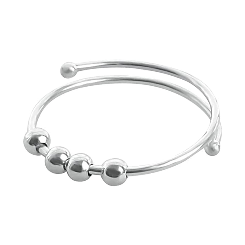 "Elegant och justerbar ångestring i silver för damer, med roterbar design för stil och stresslindring."