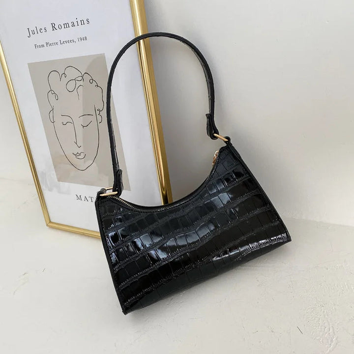 Retro crossbodyväska för dam, elegant design med stilren kedja.