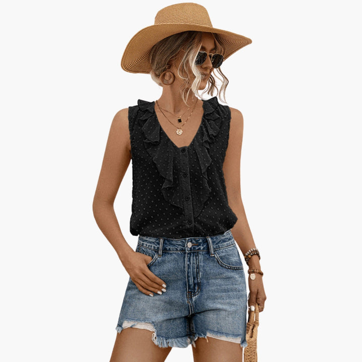 Elegant ärmlös blus för kvinnor med V-ringning och volang framtill, perfekt för sommar och casual stil.