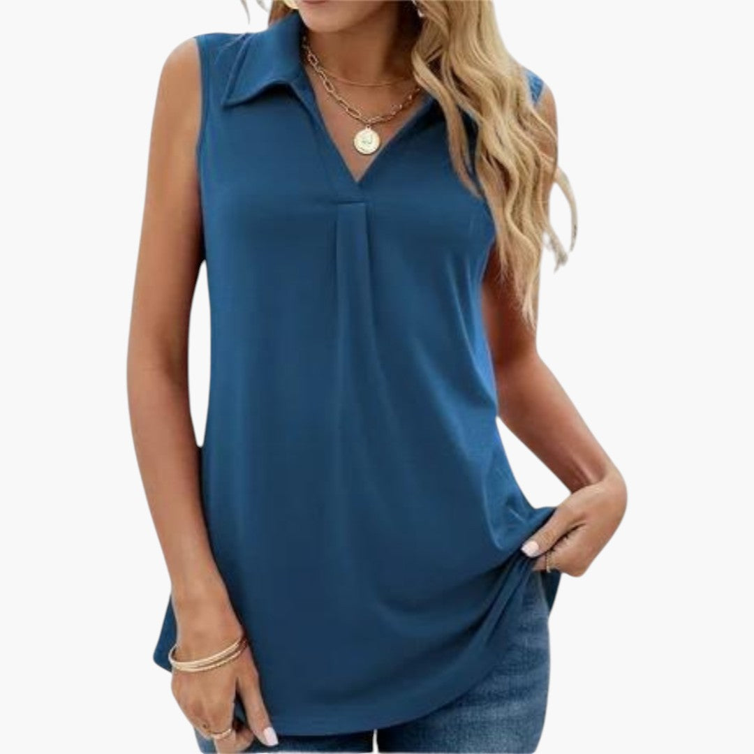 Elegant ärmlös damtopp med klassisk krage och smickrande v-ringning, perfekt för sommar & kontor.