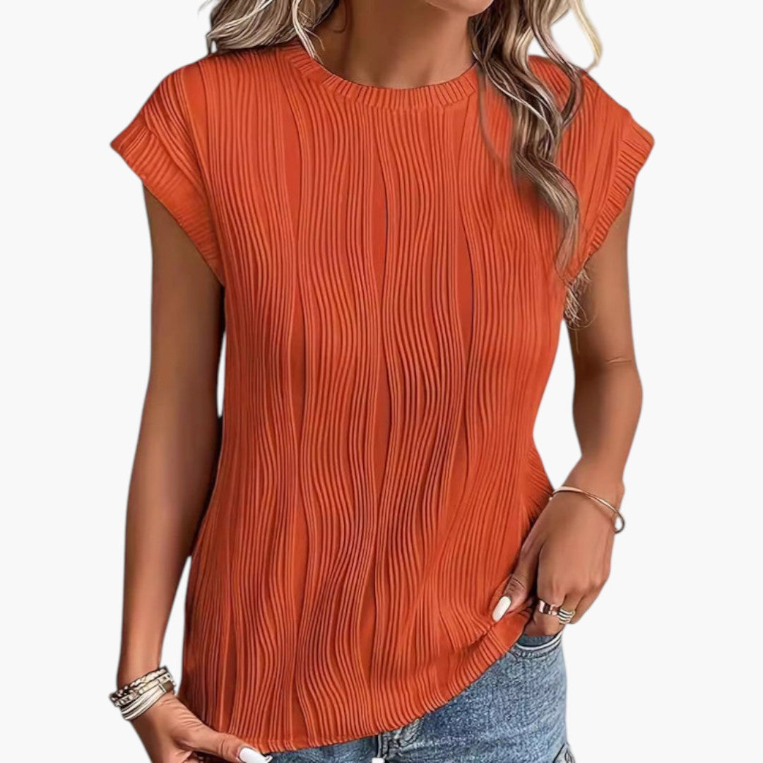 Modern ärmlös damtopp med plisserade detaljer, en trendig och bekväm casual topp.