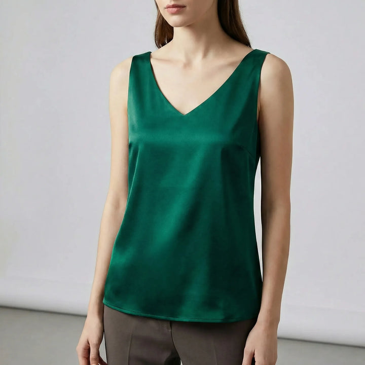 Chic ärmlös V-ringad damtopp, perfekt för att lyfta sommaroutfiten eller festlooken. Mångsidigt mode.