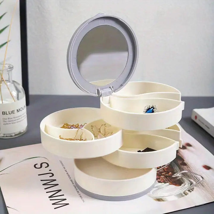 "Elegant roterande smyckesskrin med flera lager, spegel och LED-belysning för smidig och lyxig smyckesförvaring."