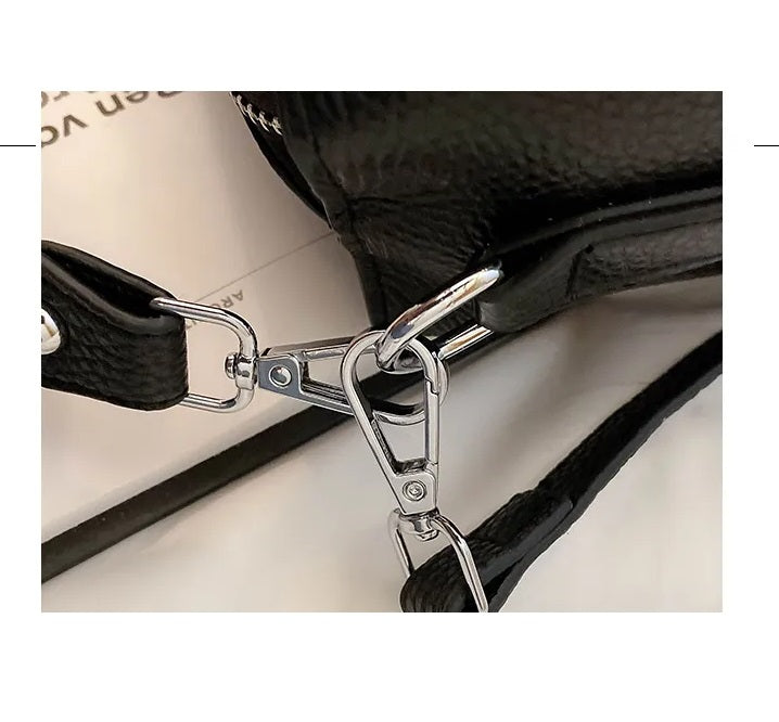 Elegant damaccessoar, en klassisk handväska som kompletterar din stil perfekt.
