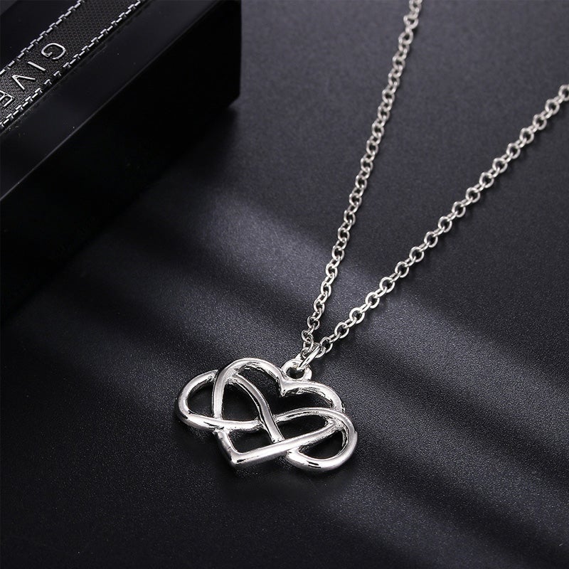 Elegant silver oändlighetshjärta halsband för kvinnor med österrikiska zirkoner, dubbel infinity design, stilfullt smycke.