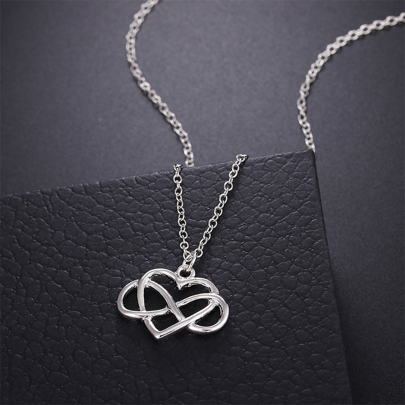 Elegant silver oändlighetshjärta halsband för kvinnor med österrikiska zirkoner, dubbel infinity design, stilfullt smycke.