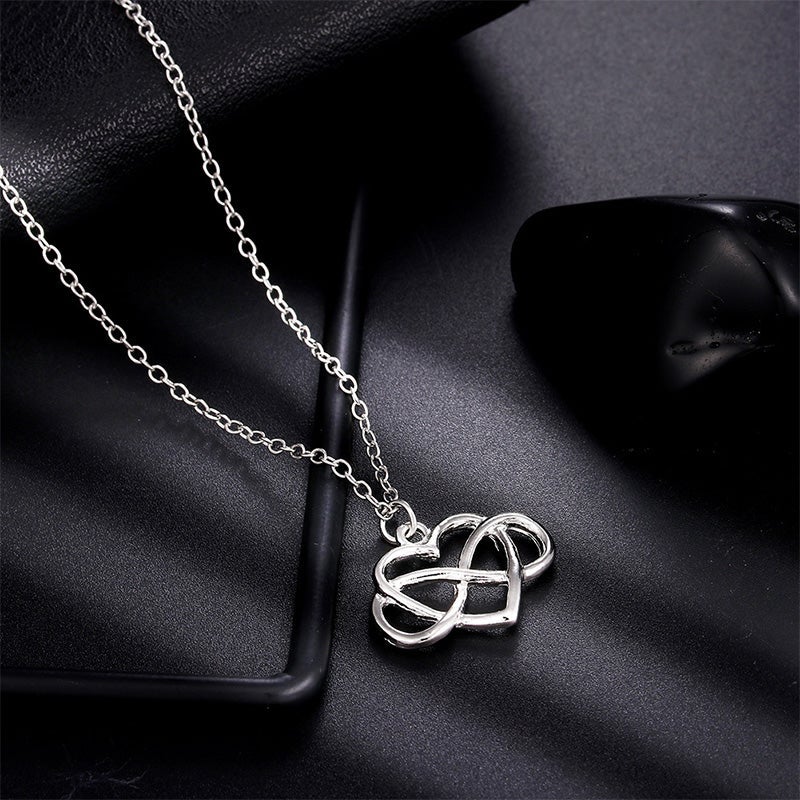 Elegant silver oändlighetshjärta halsband för kvinnor med österrikiska zirkoner, dubbel infinity design, stilfullt smycke.