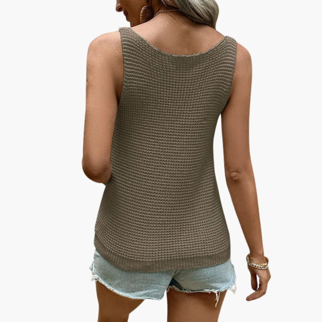 Kvinnors ärmlösa linne i texturerad stickning med rund hals. Vardagsplagg för sommar, elegant och bekvämt.
