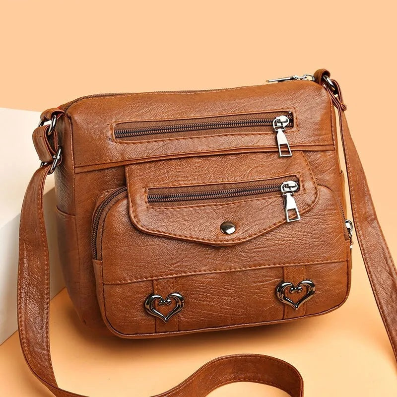 Elegant svart messenger-väska för kvinnor. Rymlig och stilren axelremsväska, perfekt vardag.