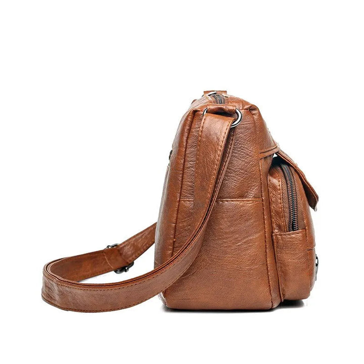 Brun elegant crossbodyväska för damer. Rymlig och praktisk för vardagen, en tidlös stil.