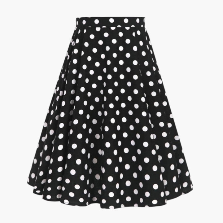 Stilren högmidjad prickig A-linje midikjol för dam. En klassisk svart och vit design för fest och vardag.