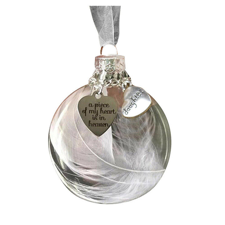 Elegant transparent julkula med vit fjäder och gravering, perfekt för juldekoration eller som en omtänksam gåva.