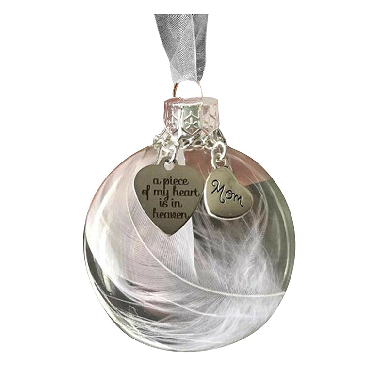 Elegant transparent julkula med vit fjäder och gravering, perfekt för juldekoration eller som en omtänksam gåva.