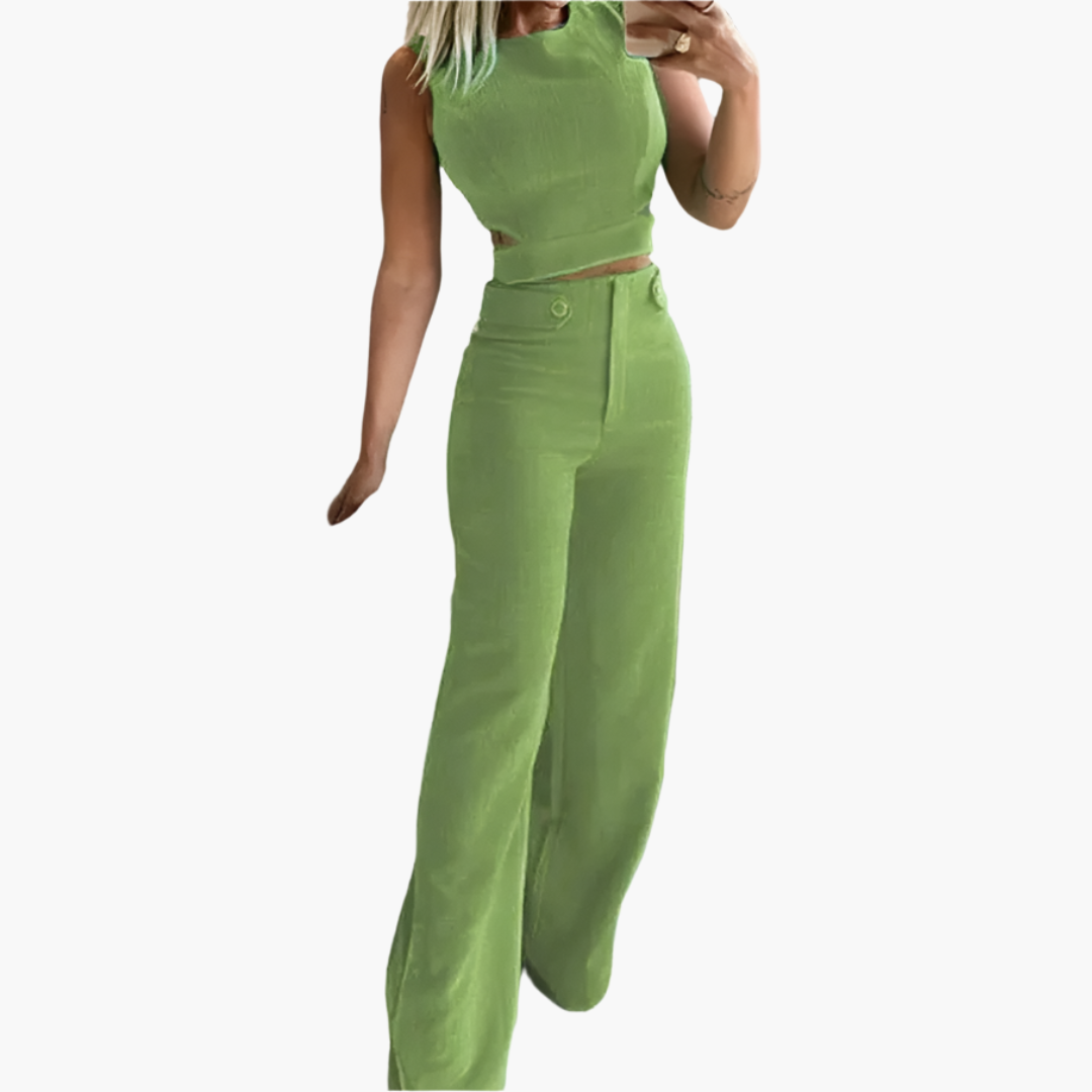 Elegant tvådelat set för kvinnor med trendig crop top och vida byxor med hög midja. Perfekt sommarstil.