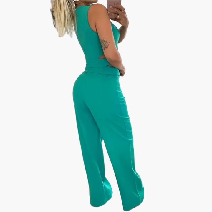 Chic damset: kort topp och vida byxor, idealiskt för fest eller en stilren vardagslook. Bekväm hög midja.