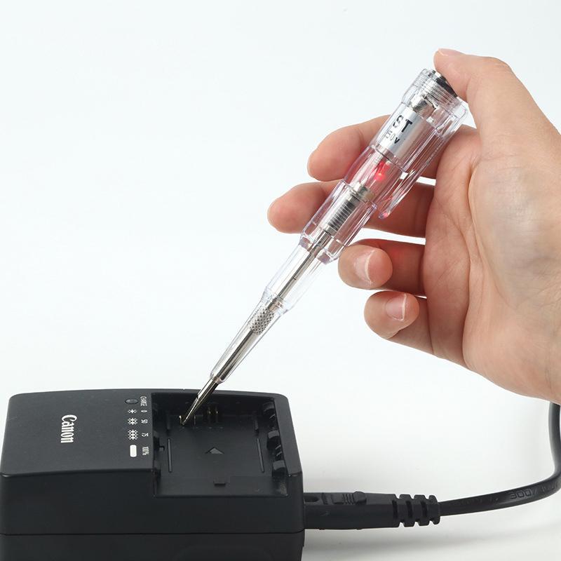 "Elektrisk testpenna med LED-ljus och transparent design, visar PVC-handtag och självkontrollfunktion för säker användning."