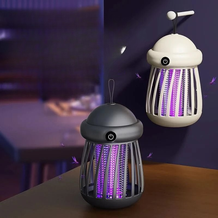 Två elektriska UV-insektsfångare i beige och grå placerade på ett bord