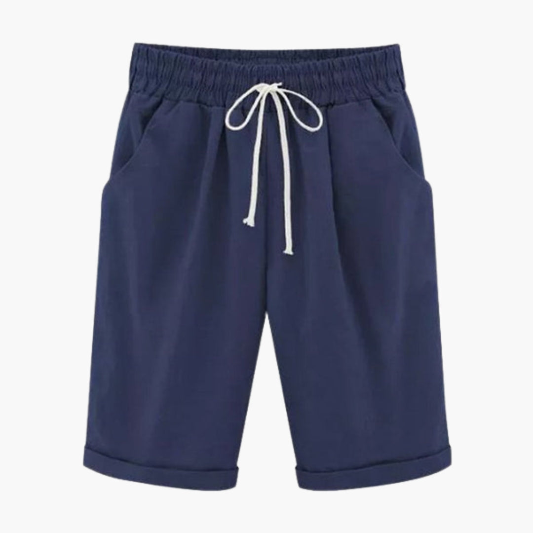 Bekväma, knälånga dambyxor med elastisk midja. Enfärgade sommarbyxor för vardag med praktiska fickor.