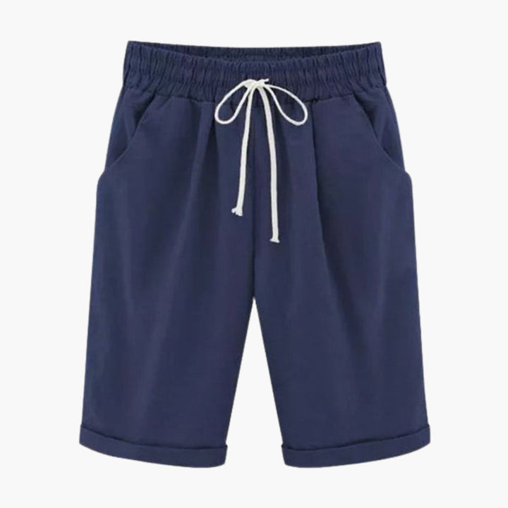 Bekväma, knälånga dambyxor med elastisk midja. Enfärgade sommarbyxor för vardag med praktiska fickor.