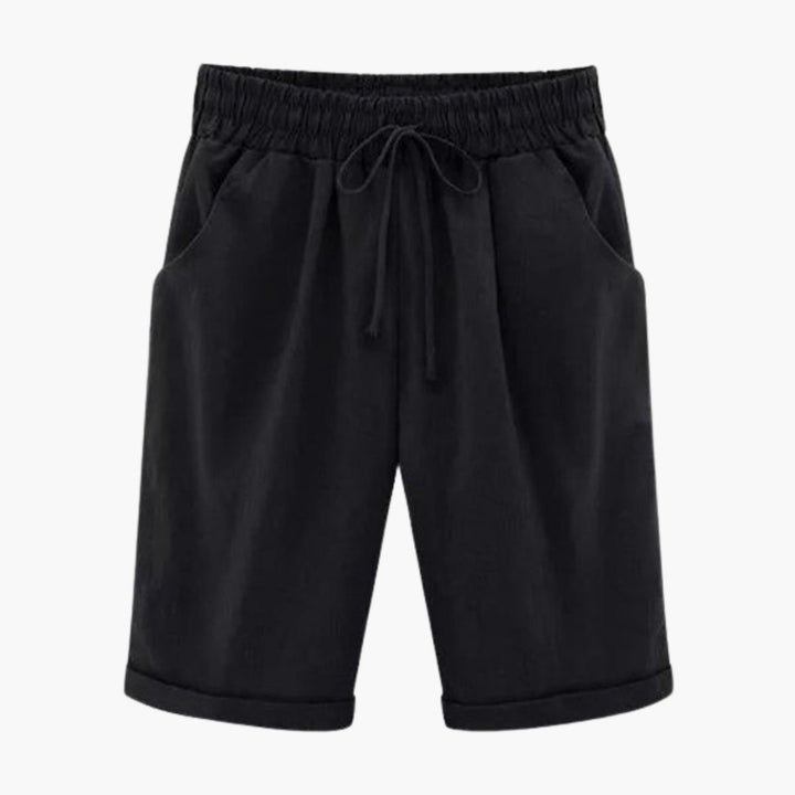 Sommarbyxor: knälånga dambyxor, pull-on design med elastisk midja och praktiska fickor. Enfärgade.