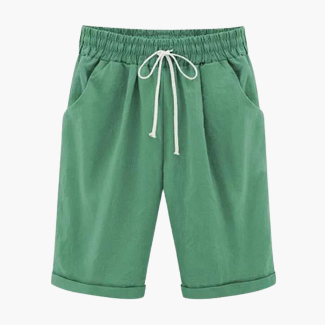 Enkla enfärgade dambyxor, knälånga med elastisk midja. Bekväma pull-on byxor med praktiska fickor.