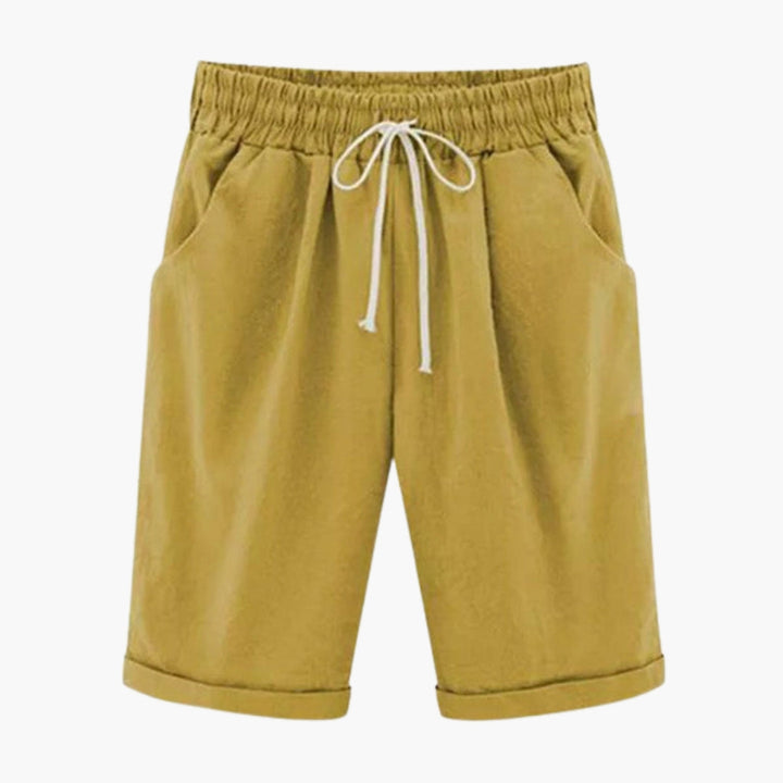 Knälånga dambyxor med skön elastisk midja och fickor. Enfärgade, bekväma pull-on vardagsbyxor.