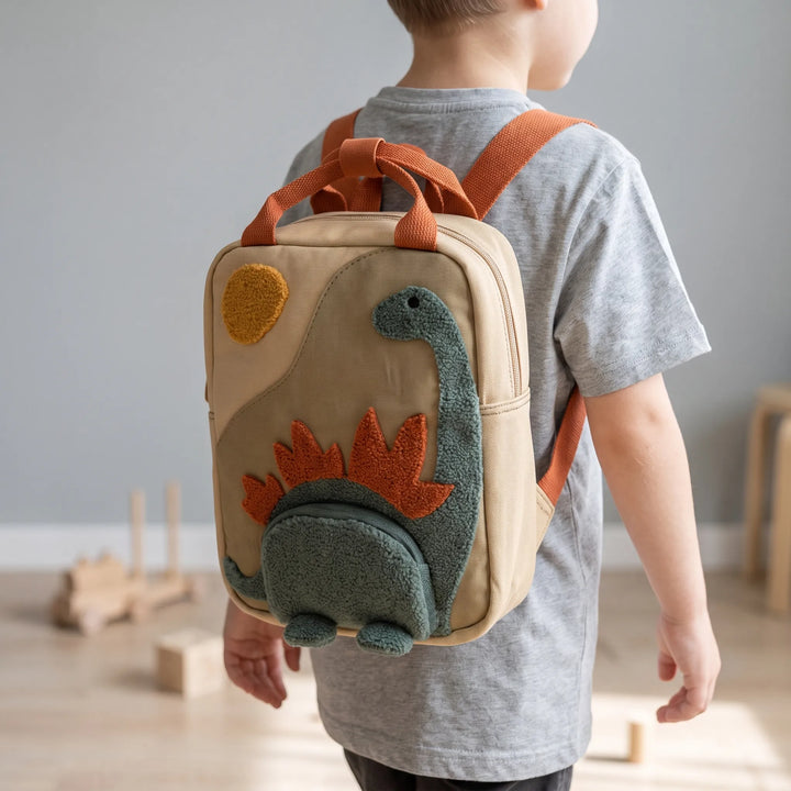 Färgglad dinosaurie-ryggsäck för barn, perfekt för förskola och skolväska. Lekfull barnaccessoar.